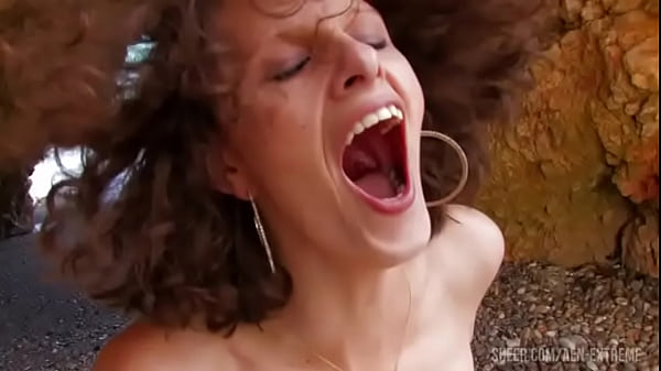 Horny mom Sophie Land walking the beach looking for a stranger to fuck