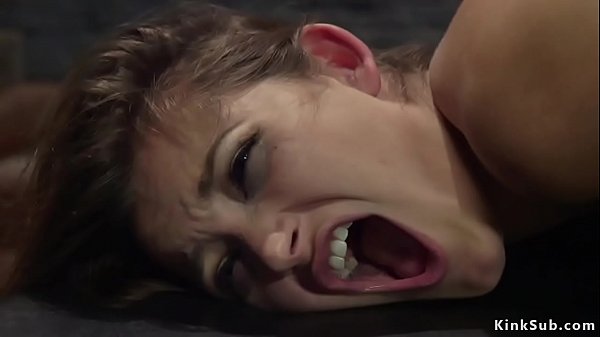 Blonde lesbian domme Lorelei Lee fingers hairy pussy to tied brunette slave Dani Daniels then fucks her with strap on cock and flogs her ass