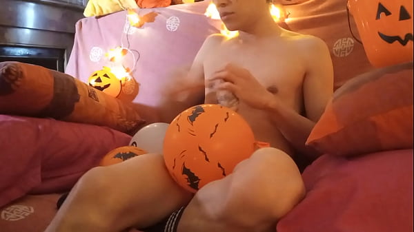 Cute gay twink gets off by pumping his cock with a Halloween balloon pump eye-rolling 