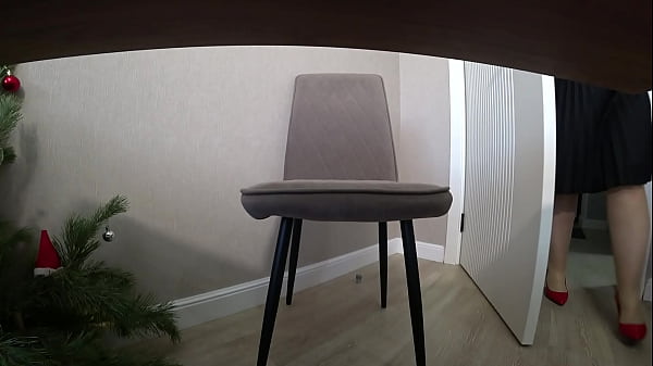 Under the boss's strict skirt. Camera under the desk in the office. Sexy milf.