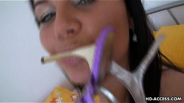 Tanned up brunette heel fucks her eager clitoris