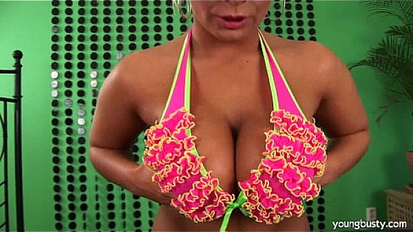 Busty young Lucie peeing