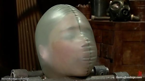 Blonde lesbian slave Star in see through lingerie bound to metal device in squating position gets cattle prod then gets pussy clamped and tormented by dominatrix Claire Adams  