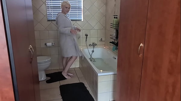 Spoiling myself to a hot bath with candles around the bathtub and rose petals in the water | soapy body wash