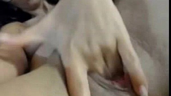 Girl in glasses, legs spread rubs wet pussy and cums on webcam