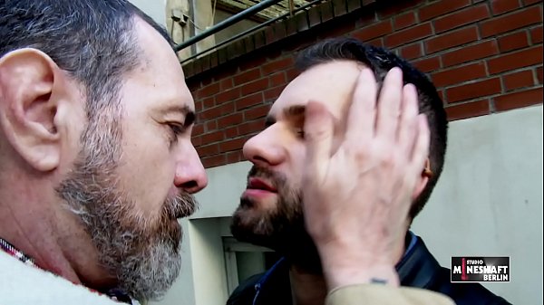 Two men meet on the street