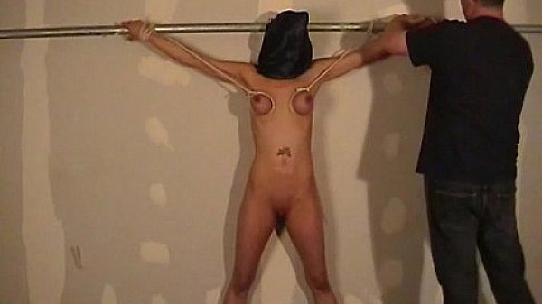 Hooded amateur bdsm and big tit whipping of Danii in bondage and dungeon punishm  