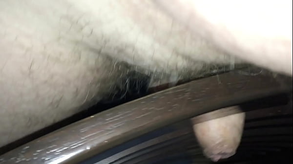 Sliding cock in and out of slats in a chair until cumshot