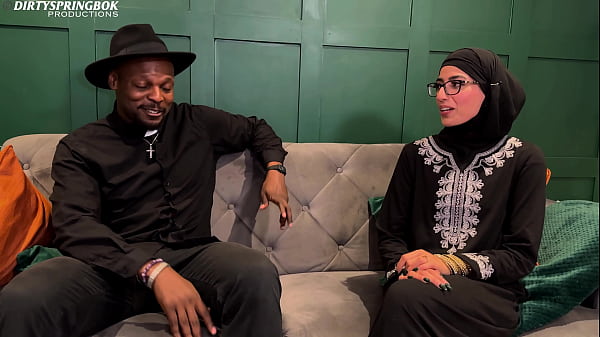 Muslim Aaliyah Yasin is blessed by Father Dimitri's holy water