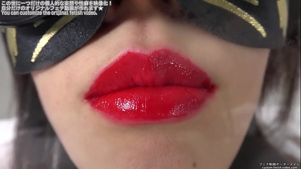 A woman who kisses glass by painting lipstick