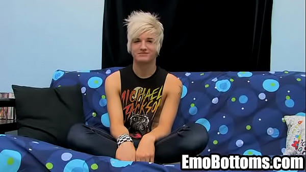 He is a sexy blonde haired punk who is masturbating  