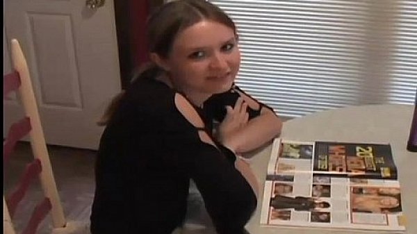 Cute teen Kitty reading a magazine and flashing her panties