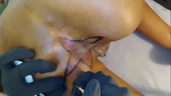 Ebony chick with star tat