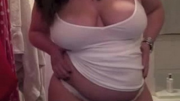 Chubby young chick getting naked in the shower