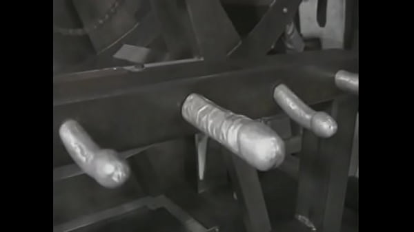 A mature blonde in a leather suit ties a young captive to a pole and hits her with a whip