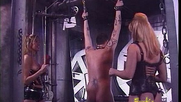 Two ravishing blonde bints whip a horny stallion in the dungeon