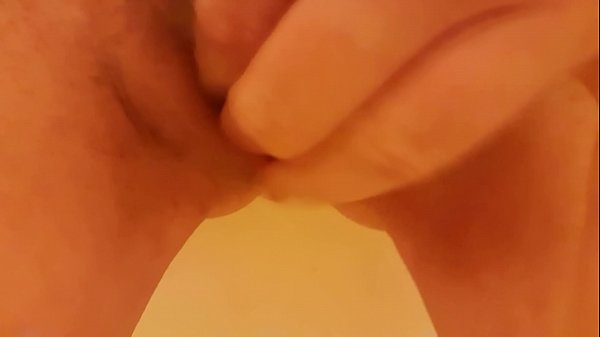 Fingering wet young pussy with peg on clit