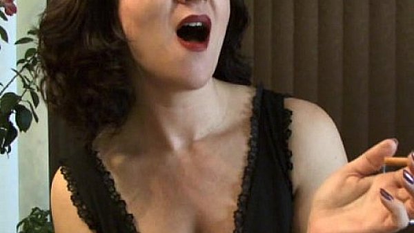 MILF Mina puffs on a cigarette