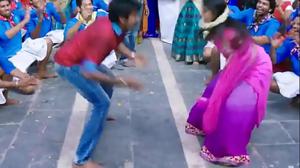 Indian people dancing on a street - movie scene