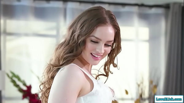 Bride cheats on gf with her gfs stepsister.Shes hiding under her dress and when her gf leaves she sucks her tits.The bride licks and fingers her pussy  