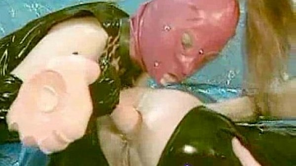 Latex covered babe fisted and fucked in her ass