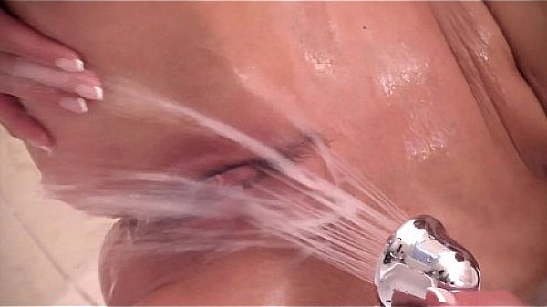 Lena Love is showering - fingering her tight pussy.