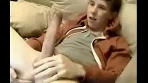 Sexy boy jerks off huge cock while fingering his ass