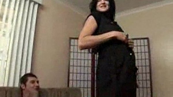 Lake Russell wearing black and doing lapdance