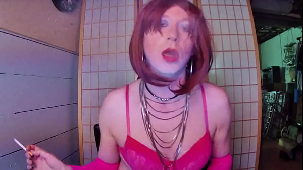 Redhead transvestite hooker Adrienne Velvet in pink bra smoking fetish 