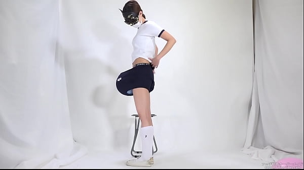 Woman putting a balloon in clothes and breaking