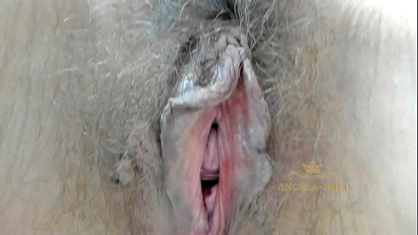 MILF fingering her furry pussy close-up  