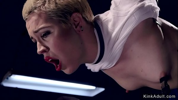 Short haired blonde slave set on wooden with all weight on her pussy gets vibrated