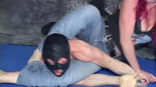 Red headed mistress beats a masked man in a mixed wrestling  