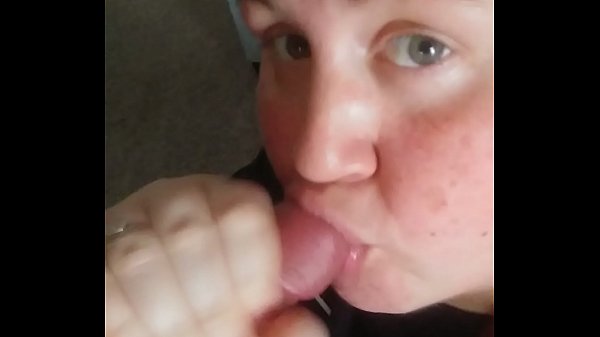 down on her knees licking his balls