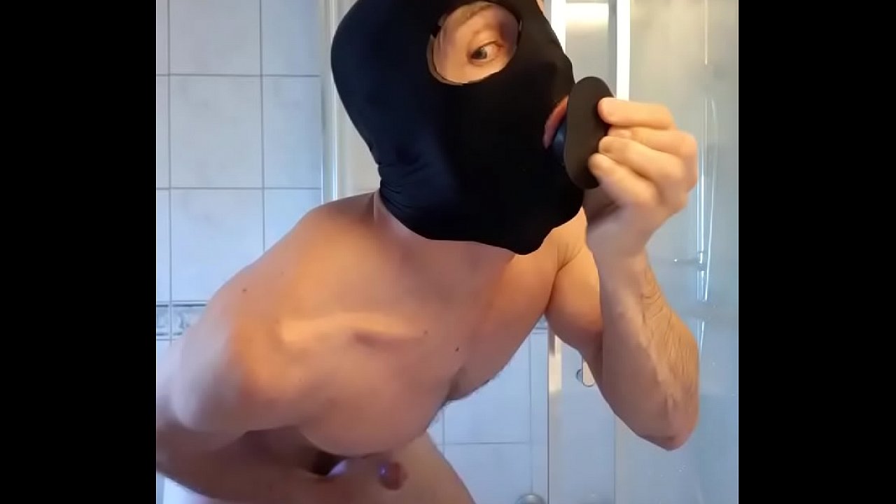 Dildo play by slave in bathroom