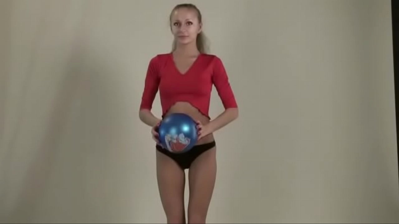 Teen stretches her legs and body showing huge tits