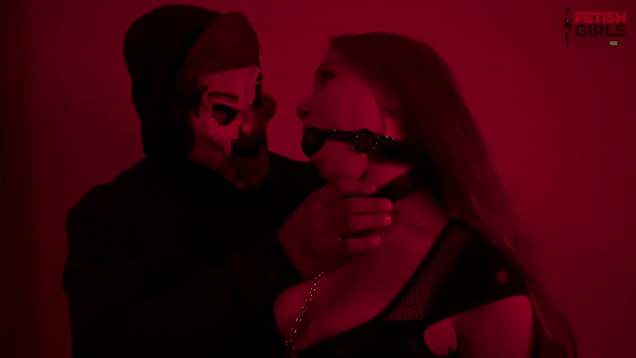 The Enigmatic and two Latin submissive girls, a busty blonde and a redhead with a big ass