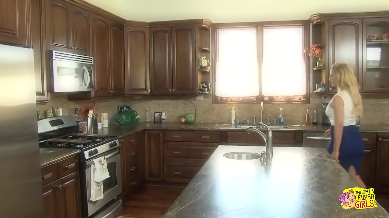 Passionate kissing in the kitchen leads two lesbians to strip naked and finger each other