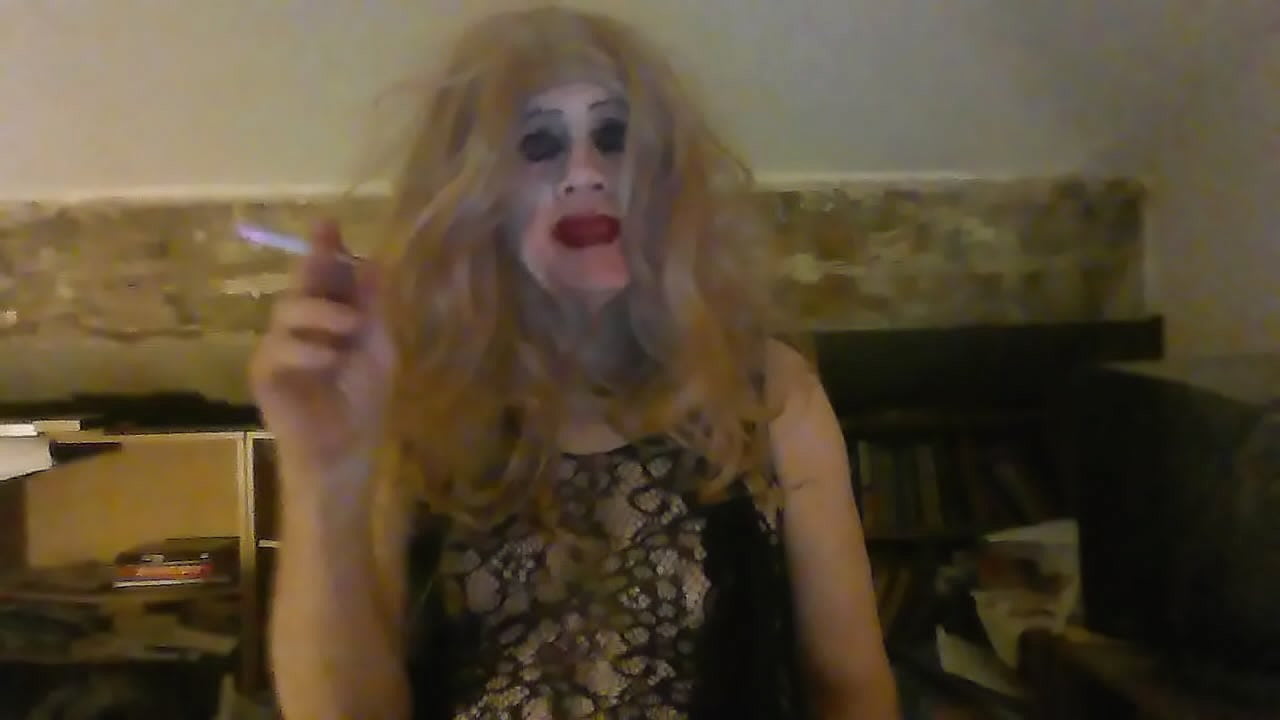 Smoking Fetish Sissy, Sarah, enjoys an illicit cigarette