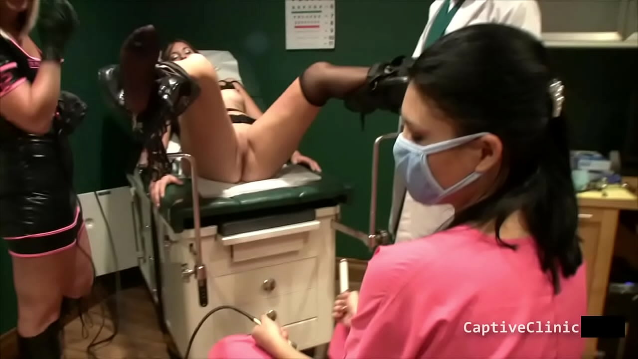 Crystal Frost And Angel Rose Both Get Tormented Side By Side As Doctor Tampa And Nurse Administer High Voltage Using A Violet Wand AtBondageClinicCom