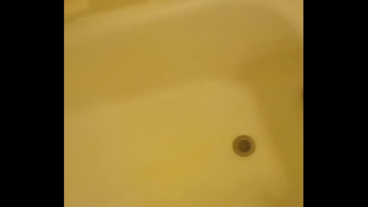 Urinating unto the bathtub