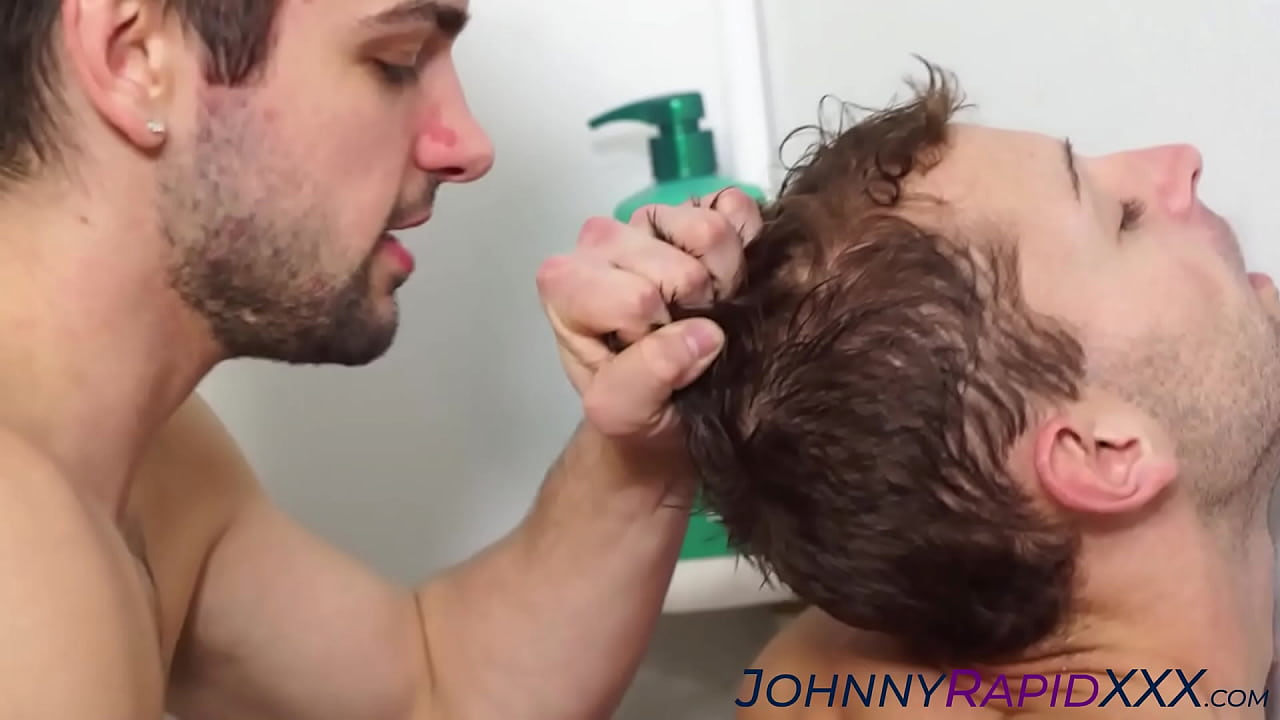 Hairy hunk Johnny Rapid passionately fucks sexy Trevor in a steamy shower, their bodies entwined in a wet embrace. Bringing you more exclusive content at JohnnyRapidXXX.com