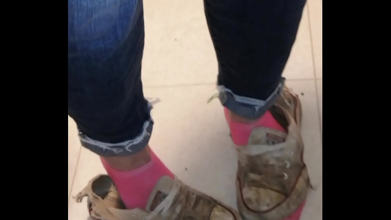 Trashed sneakers and jeans