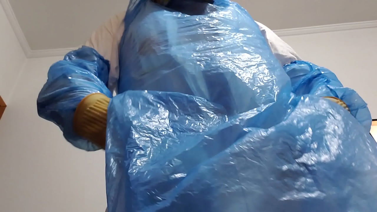 A cumshot on the glove, wearing a stinky jumpsuit and stinky rubber boots