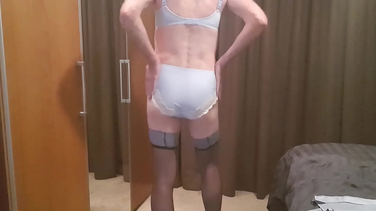 Man parades around in a Blue lingerie set and masturbates on it.