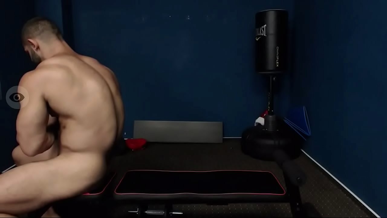 Naked guy lifting weights