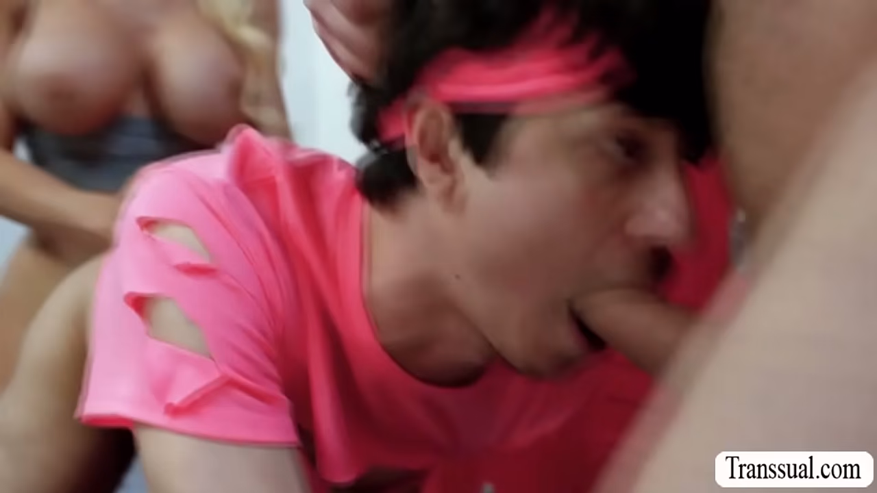 Busty shemale is in the gym with this two dude.After that,they start sucking each others hard big cock