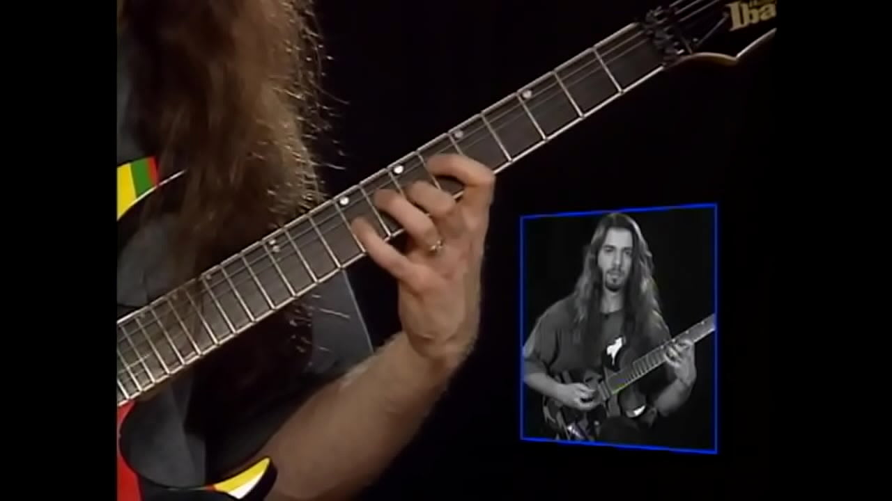 John Petrucci fingering electric guitar