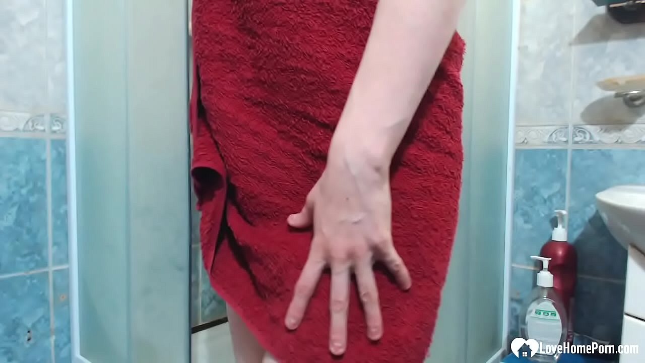 As she was taking a shower, she started to rub her beautiful pussy with fingers.