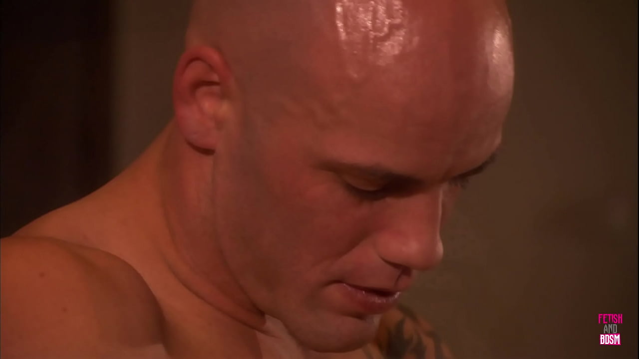 The attractive woman expresses intense pleasure as the bald man orally stimulates her hairless genital area